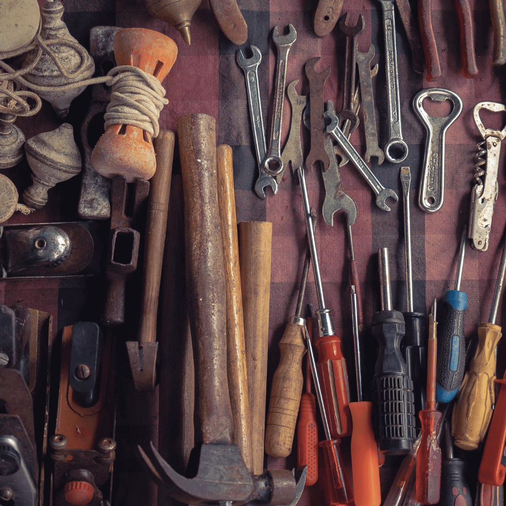 Different kinds of tools including wrenches, hammers, and screwdrivers