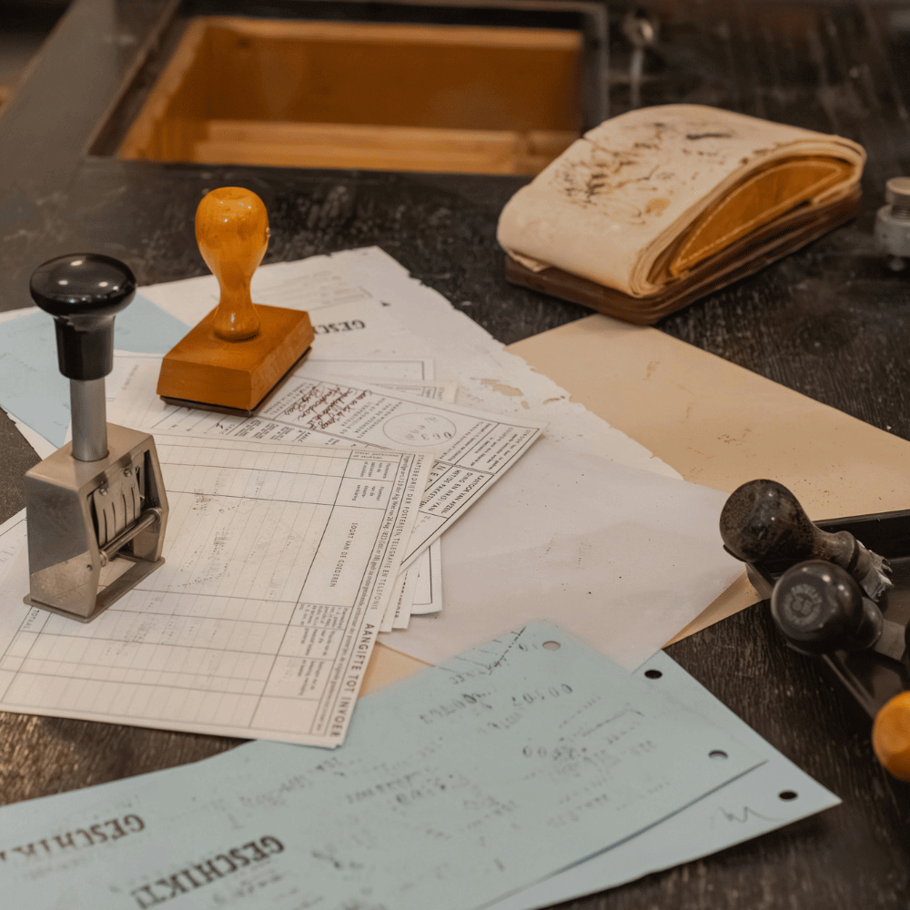 Paper clutter and random items on a desk