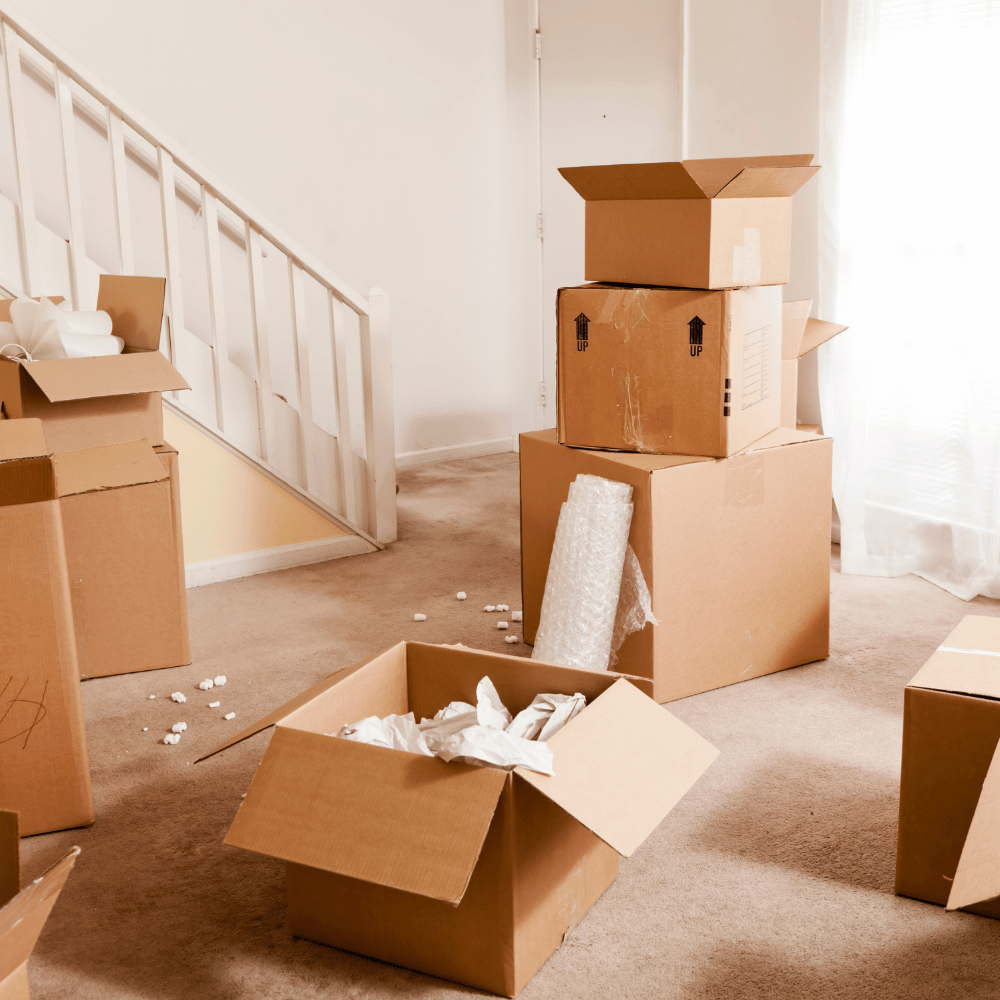 A room with moving boxes ready for junk removal services.